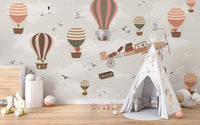 Artistic nursery mural showcasing a sky safari of wildlife in motion.
