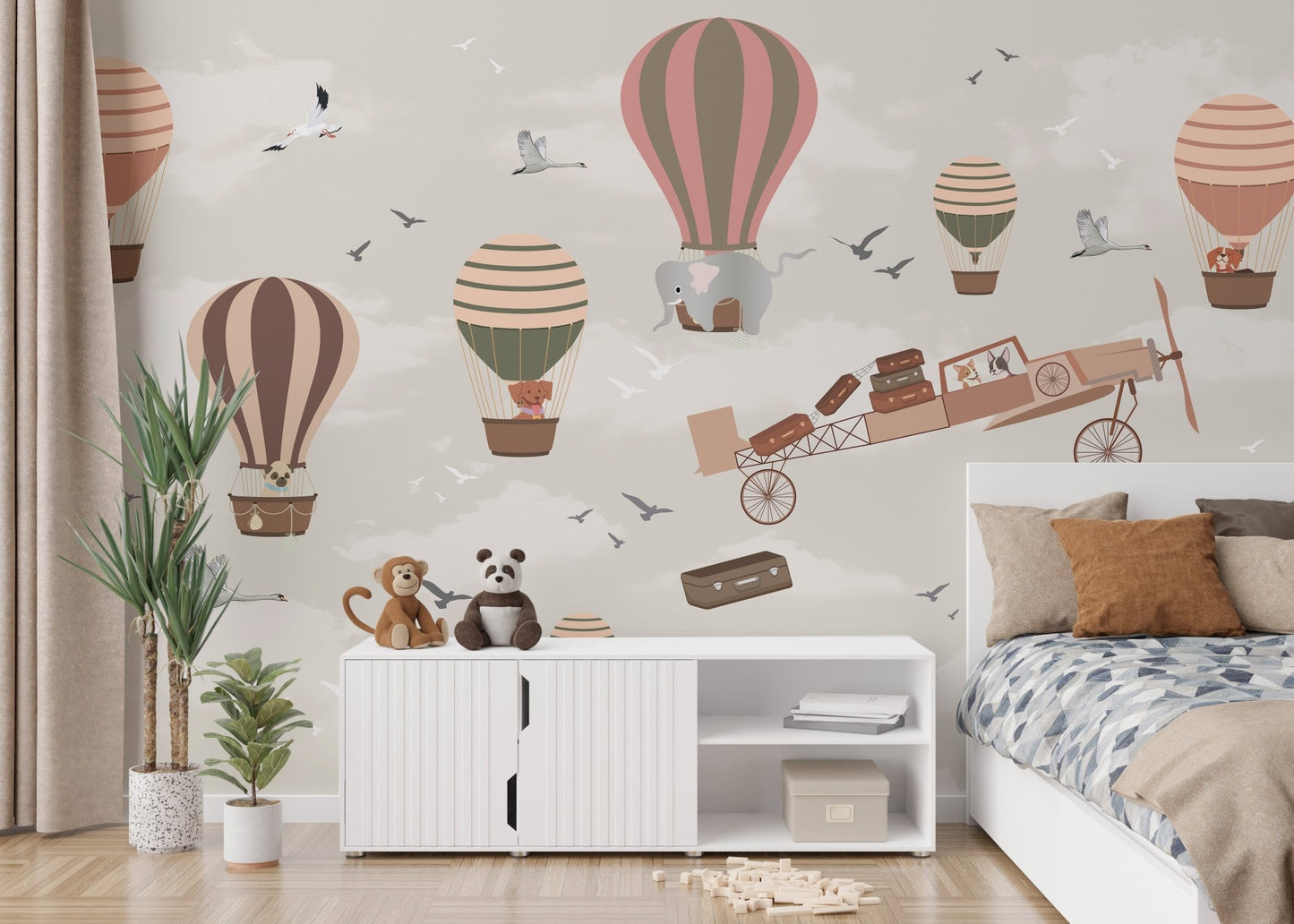 Vibrant bedroom mural featuring wildlife in a whimsical sky safari scene behind bed.
