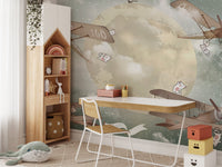 Dreamy star gliders mural in a child's study area with white desk.