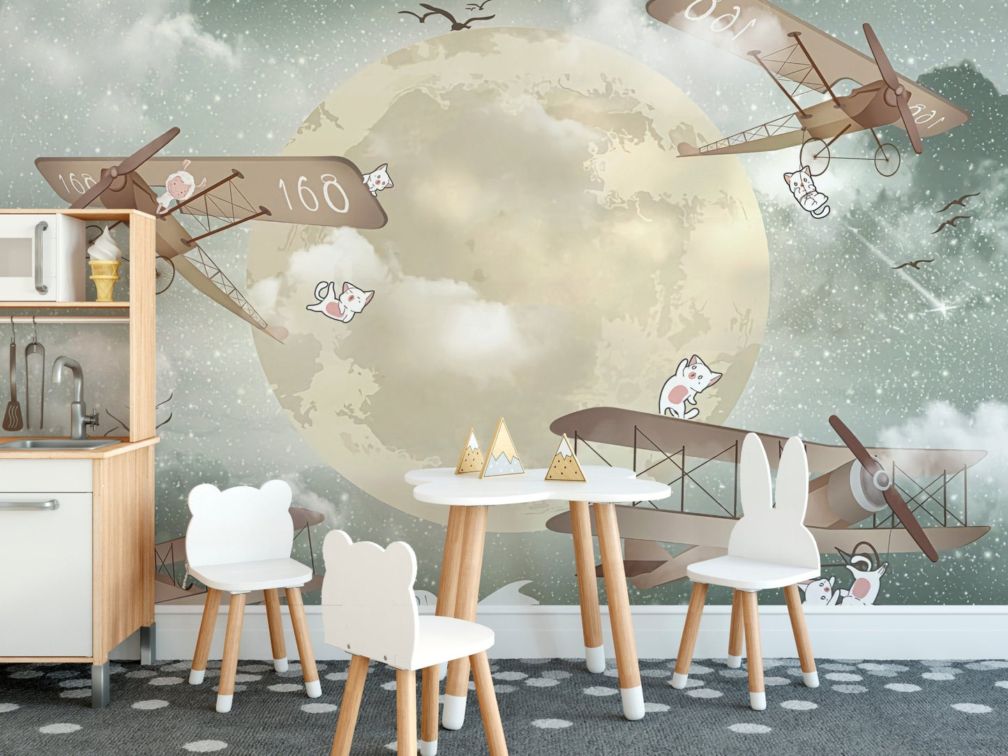 Kids dining room mural with gliders under a starlit sky.