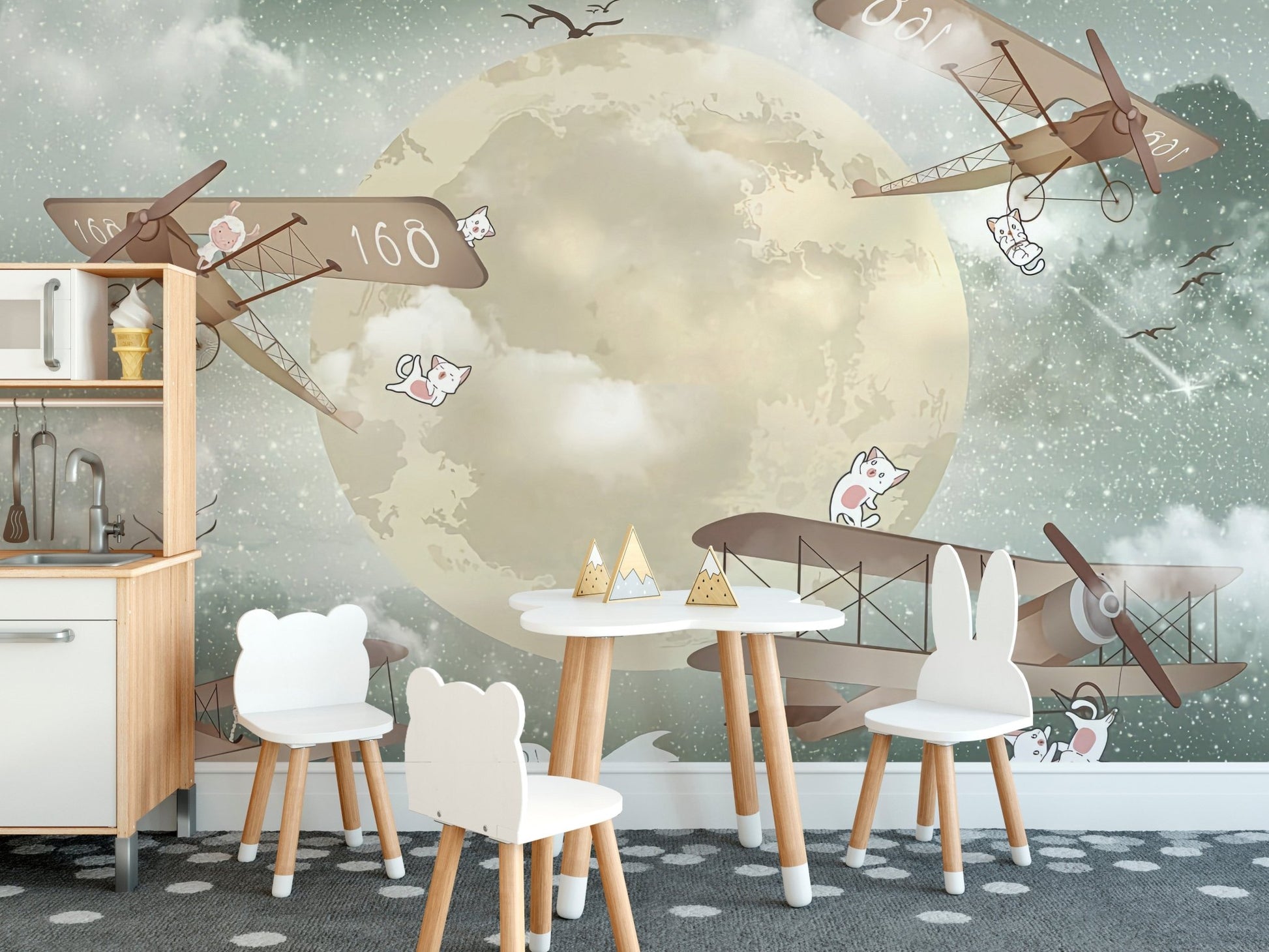 Kids dining room mural with gliders under a starlit sky.