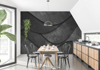 Textured black 3D wave wall mural in a bright dining room setting