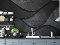 Matte black wave wall mural in a modern kitchen with grey cabinets
