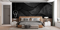 Sleek Black 3D Wave Wall Murals behind a tan leather bed frame