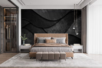 Dark 3D wave wall mural in a bedroom with wooden furniture accents