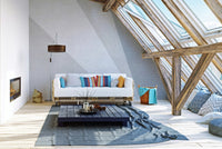 Abstract grey concrete wall mural in a spacious attic living area with skylights.