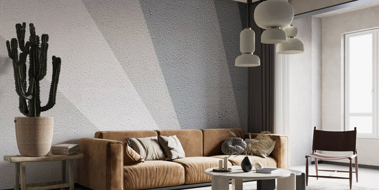 Sleek diagonal pattern wall mural in a living room featuring a brown leather couch.