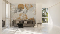 Floral wall mural with gold leaf patterns in an open-plan apartment.