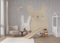 Whimsical nursery wall mural with a beige bear and white bunny.