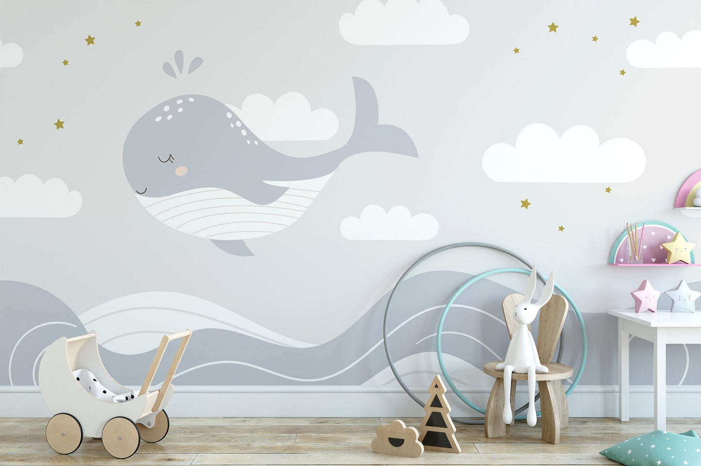 Sleeping whale wallpaper mural with gray ocean waves and stars.
