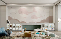 Calming clouds mural with dreamy whale accents in nursery.