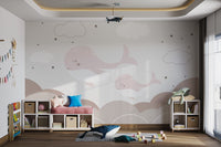 Peaceful wall art mural featuring sleepy whales and sky in kids play area.