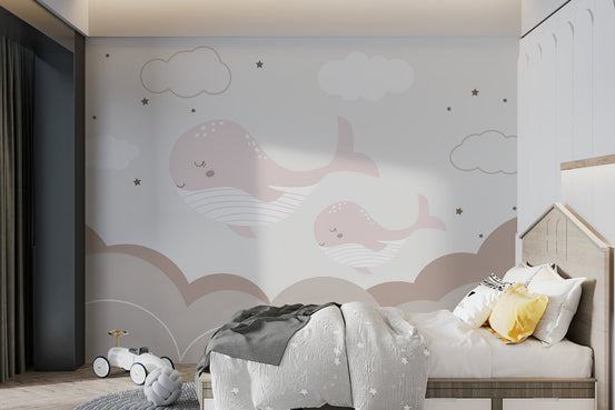 Dreamy wall mural with sleepy whales and clouds for kid room.