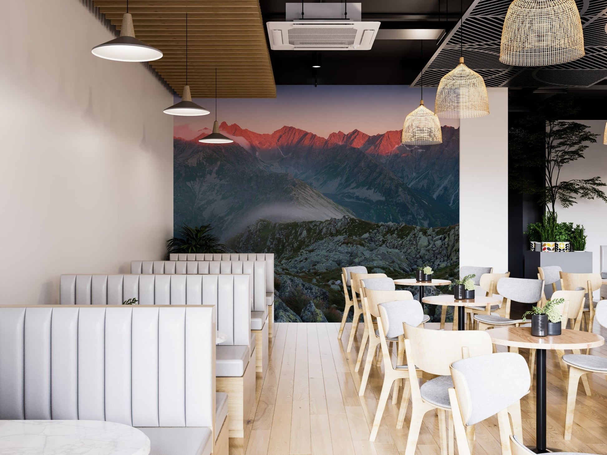 Restaurant interior featuring a large mountain landscape wall mural