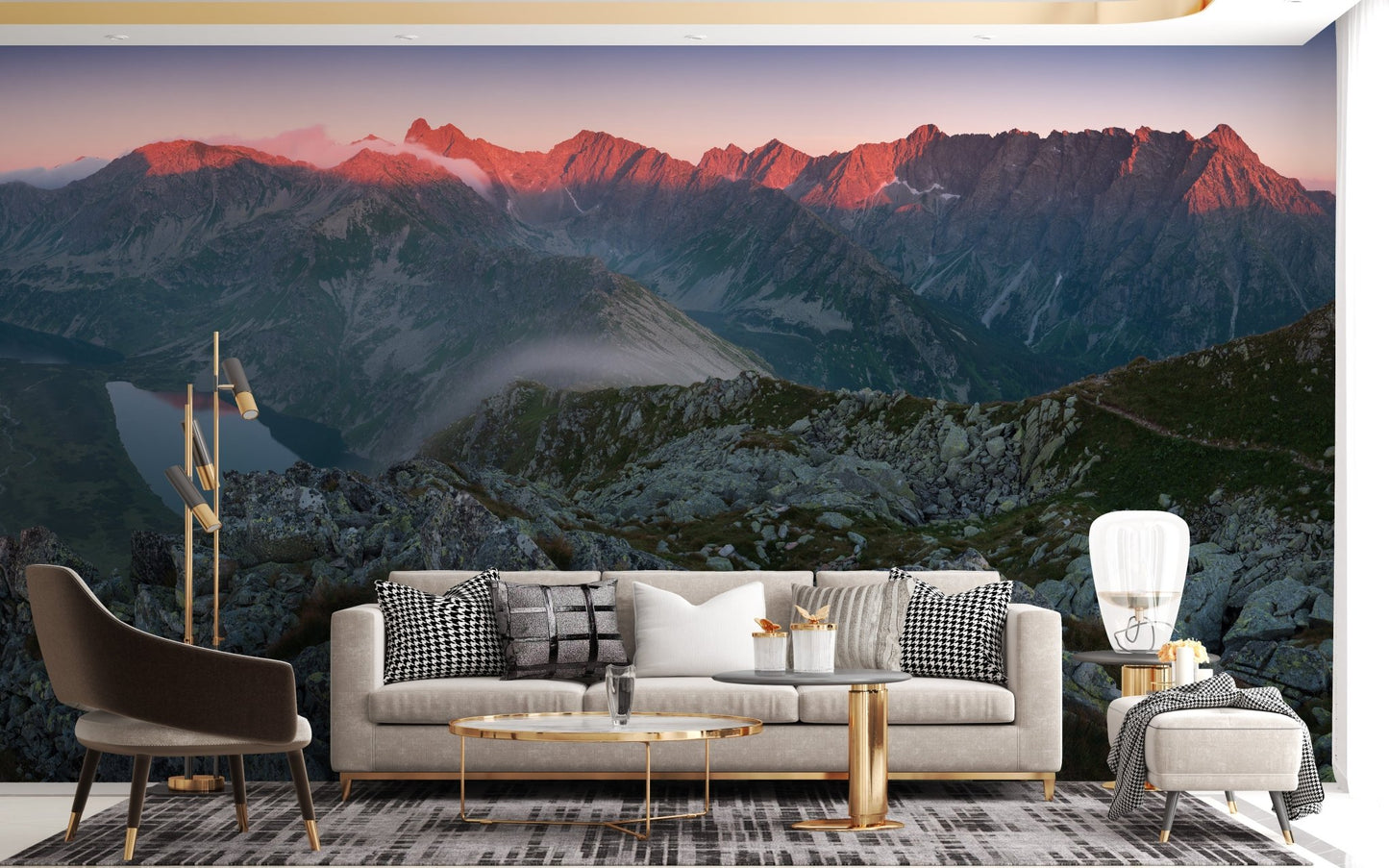 Grey and orange mountain wall mural in a living area with marble coffee table.
