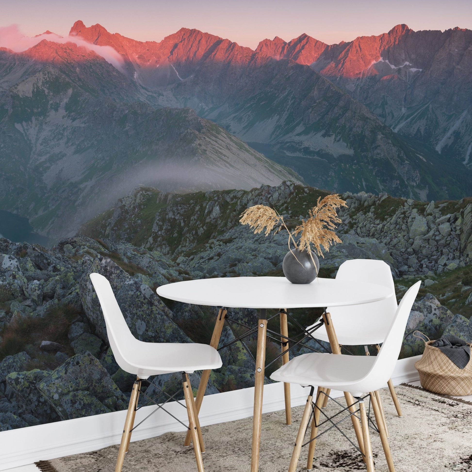 Scenic sunset wall mural with white dining chairs and circular table
