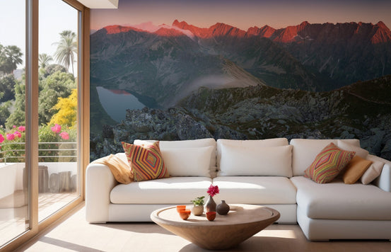 Living room wall mural with white sofa and sunset mountain peaks