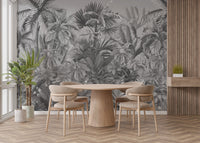 Tropical forest wall mural backdrop for a round dining table and oak chairs.