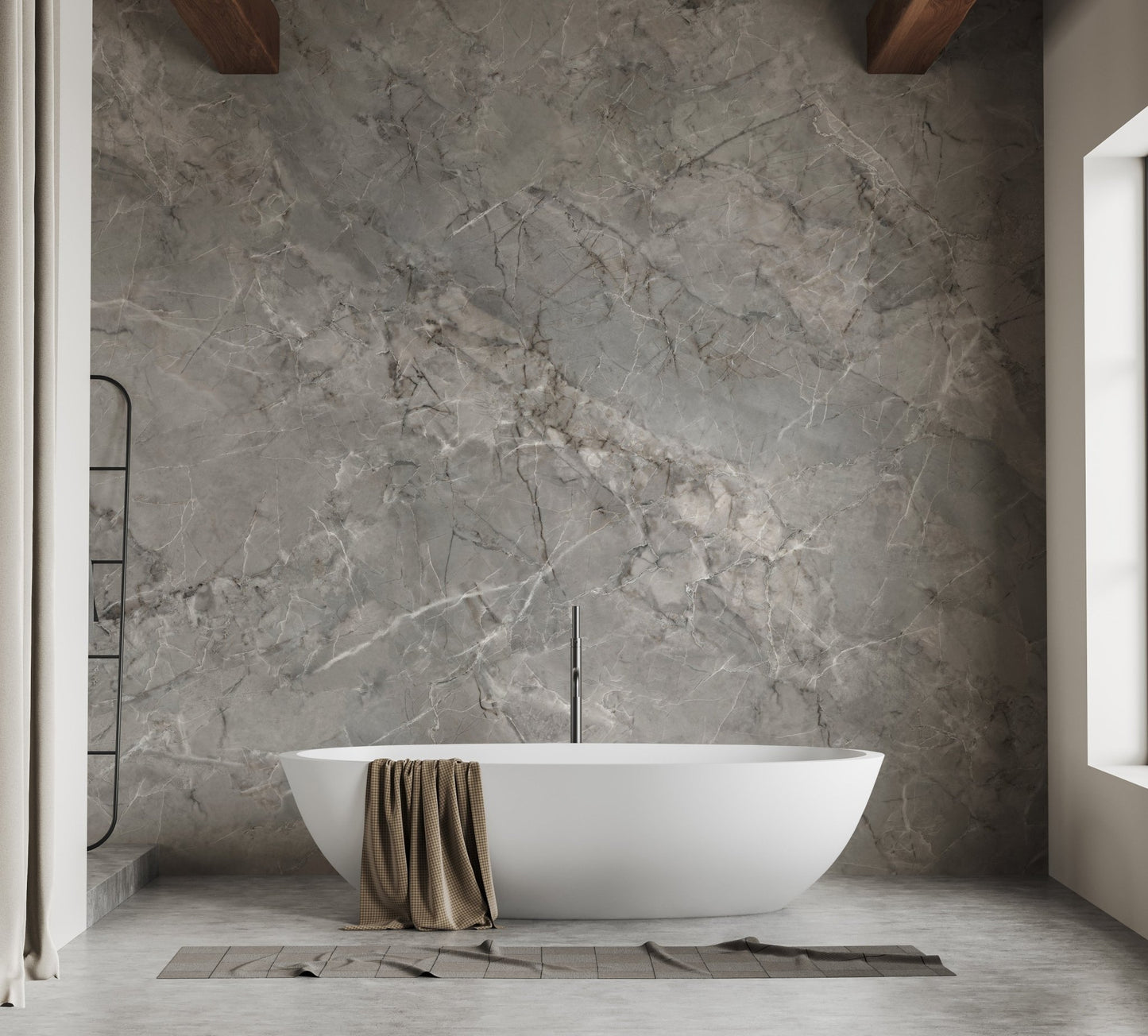 Grey stone effect wall mural in a bathroom behind a white freestanding tub.