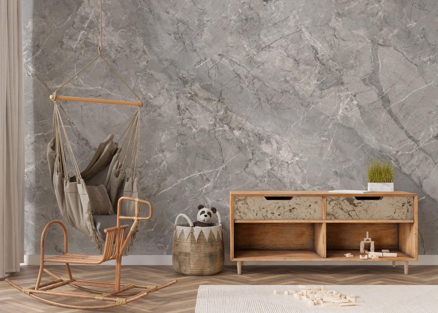 Textured marble wall mural in a minimalist room with a wooden sideboard.