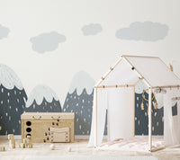Kids room wall mural with grey mountains behind a white wooden house bed frame.