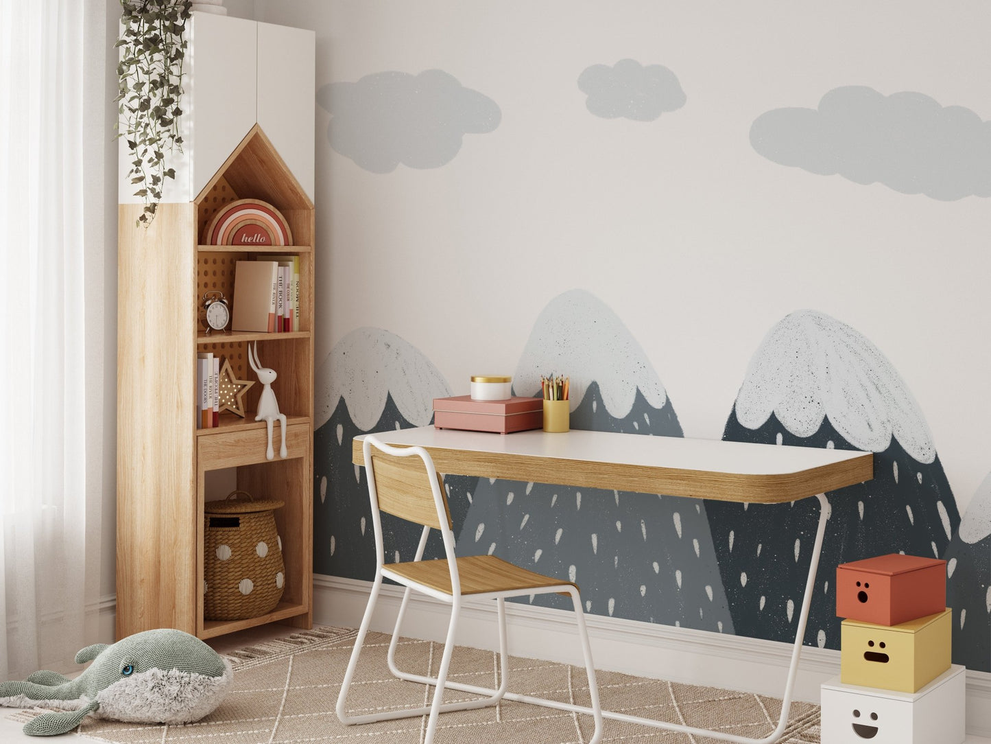 Grey and white mountain wall mural in a study area with a wooden desk and chair.