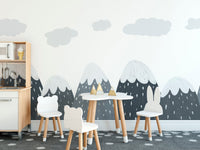 Grey mountain wall mural in a dining area with a white table and bunny chairs.