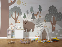 Modern playroom wall mural with grey forest and a white storage cabinet.