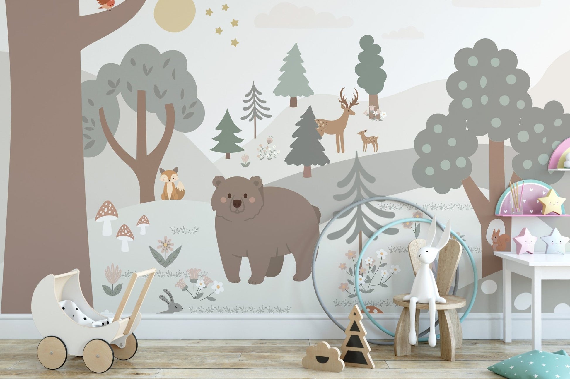 Forest themed wall mural behind a wooden toys and white bunny in playroom.