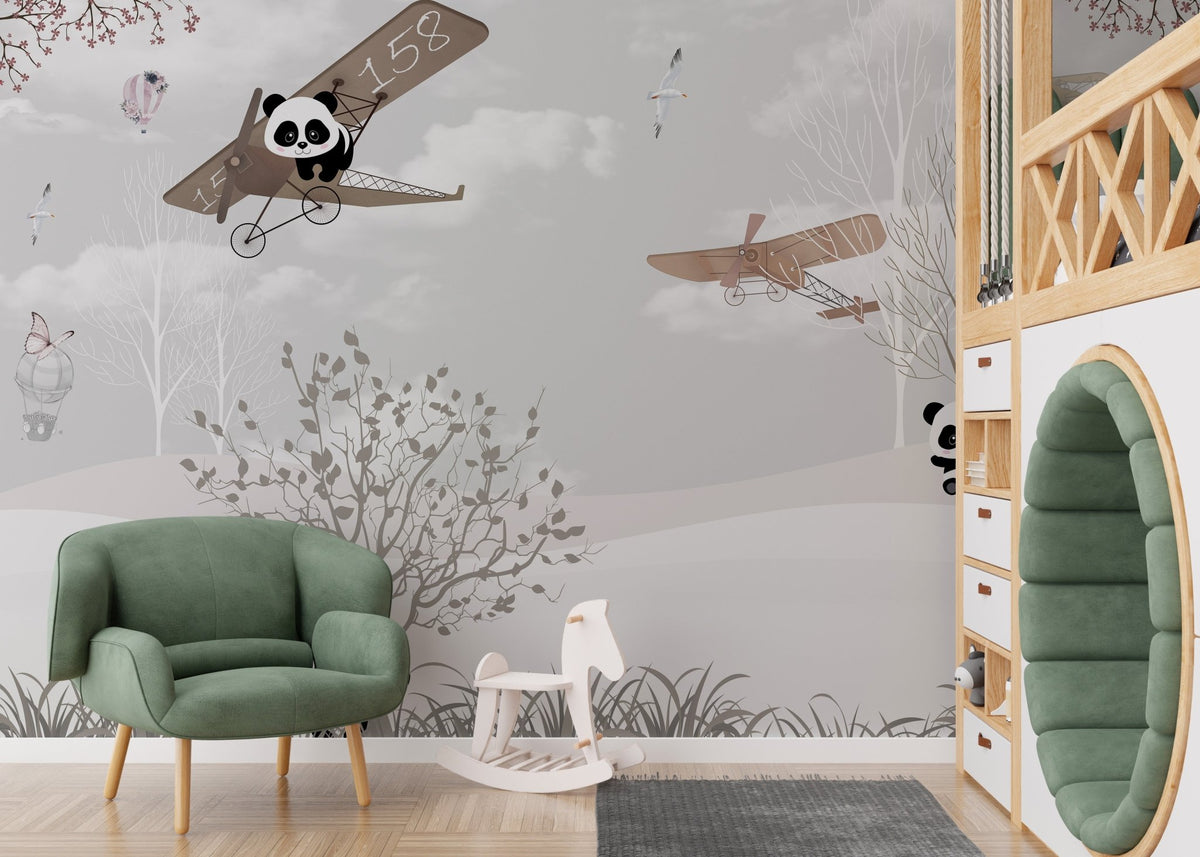 Snowy Panda Wings of Wonder Wall Murals in a nursery with a green armchair.