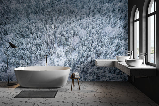 Snowy winter forest aerial wallpaper featuring white frost-covered branches.