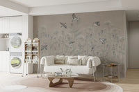 Beige botanical wallpaper mural with soaring sparrows and soft blue stems.
