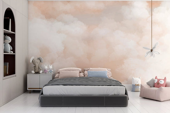 Dreamy peach sky wallpaper with soft white clouds.