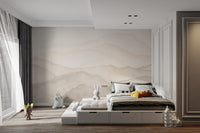 Layered mountain silhouette wall mural in warm neutral color.