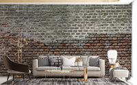 Living room with grey sofa and Soiled Dirt & Rustic Brick Wall Mural.