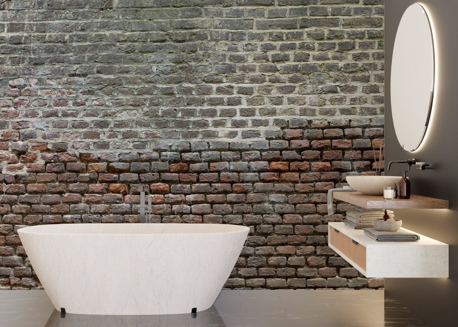 Bathroom interior with aged brick wall mural behind a white freestanding tub.