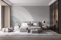 Minimalist arc pattern wall mural in muted green and white shades.