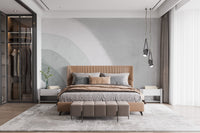 Textured grey wallpaper mural with overlapping circular forms.