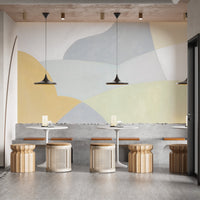 Modern geometric wallpaper mural with curved shapes and soft color tones.