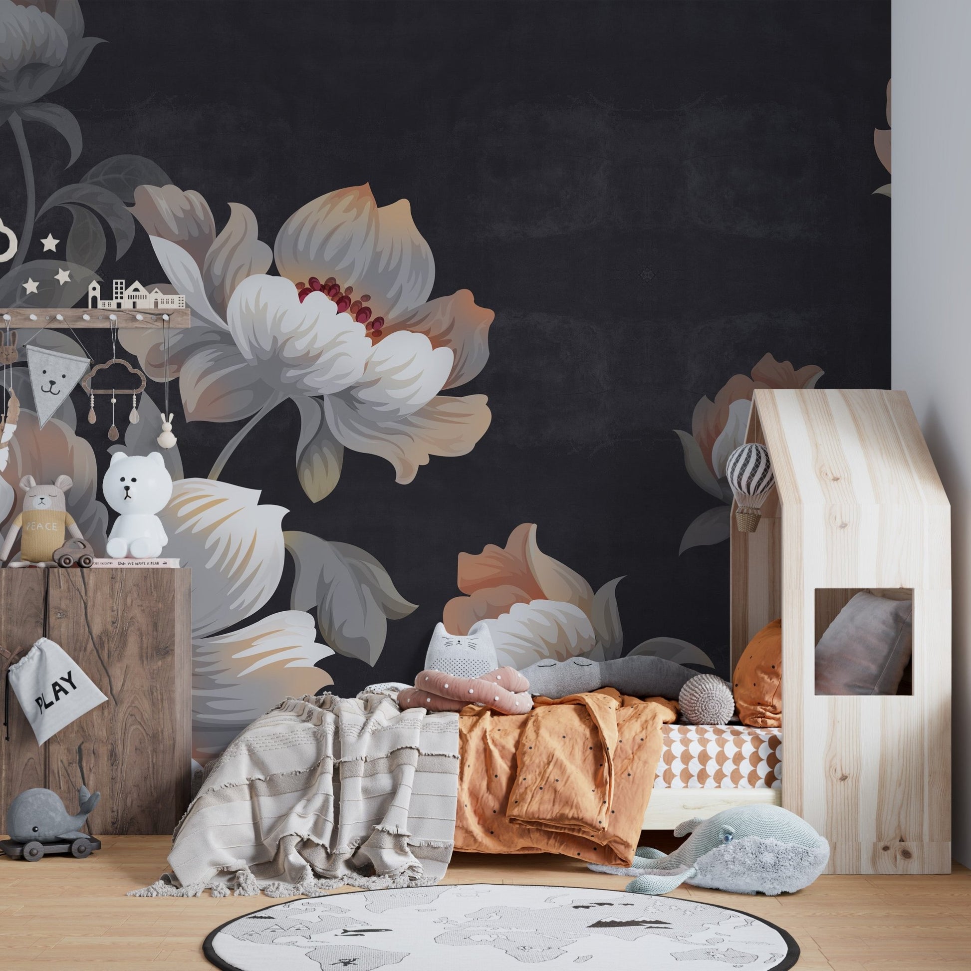 Nursery wall mural featuring dark flower patterns behind a wooden house bed.