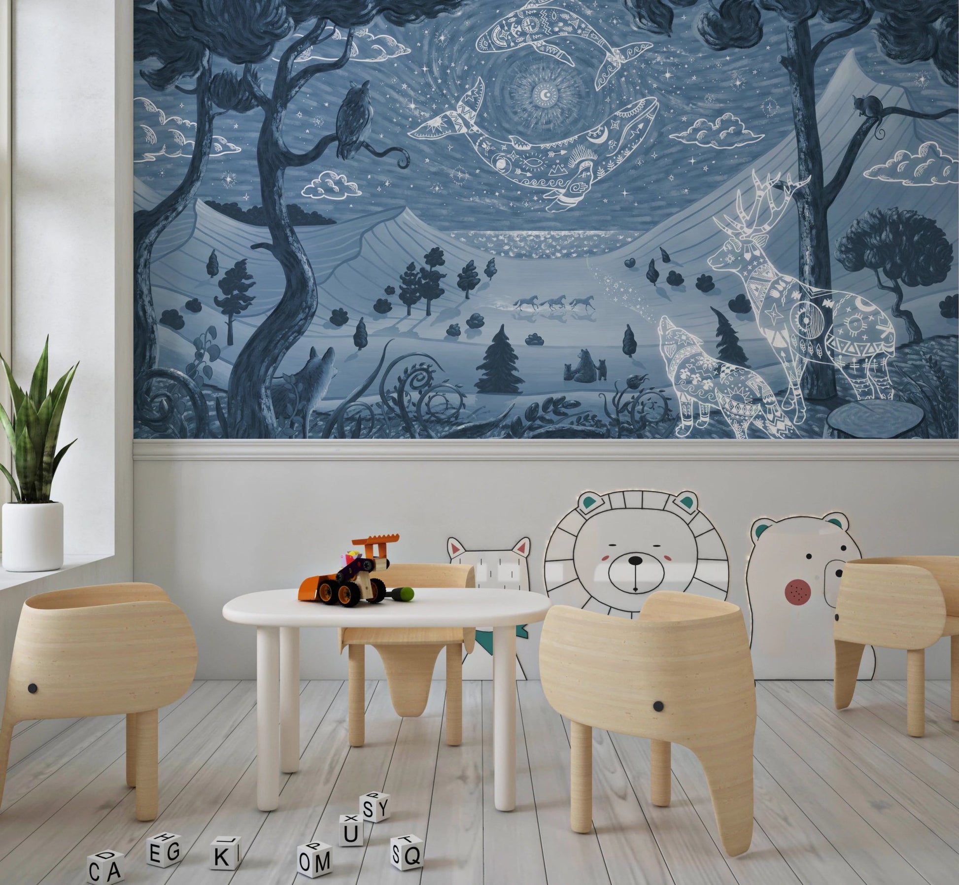 Playroom with white table, wooden chairs, and blue night sky wall mural.