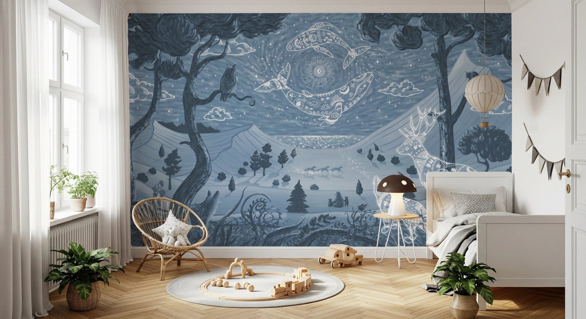 Large scale blue wall mural with deer and owl motifs in a bright kids bedroom.