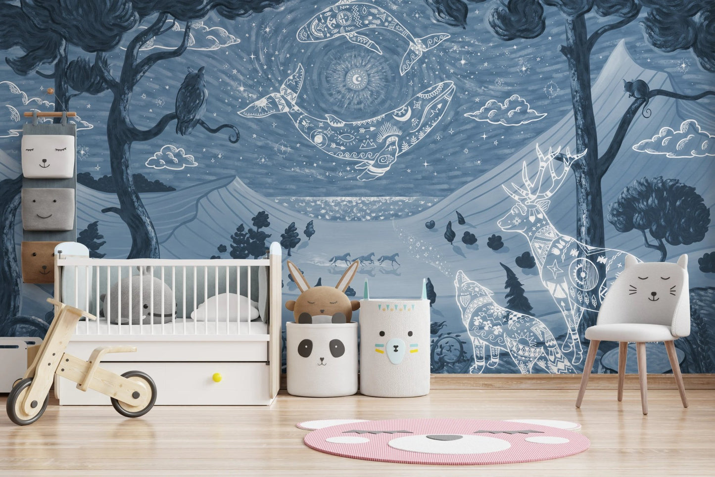 Spirit Night Blue Wall Mural in a nursery with a white wooden crib and toy bike.