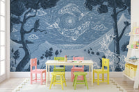 Kids play zone with colorful chairs and blue mountain range wall mural.