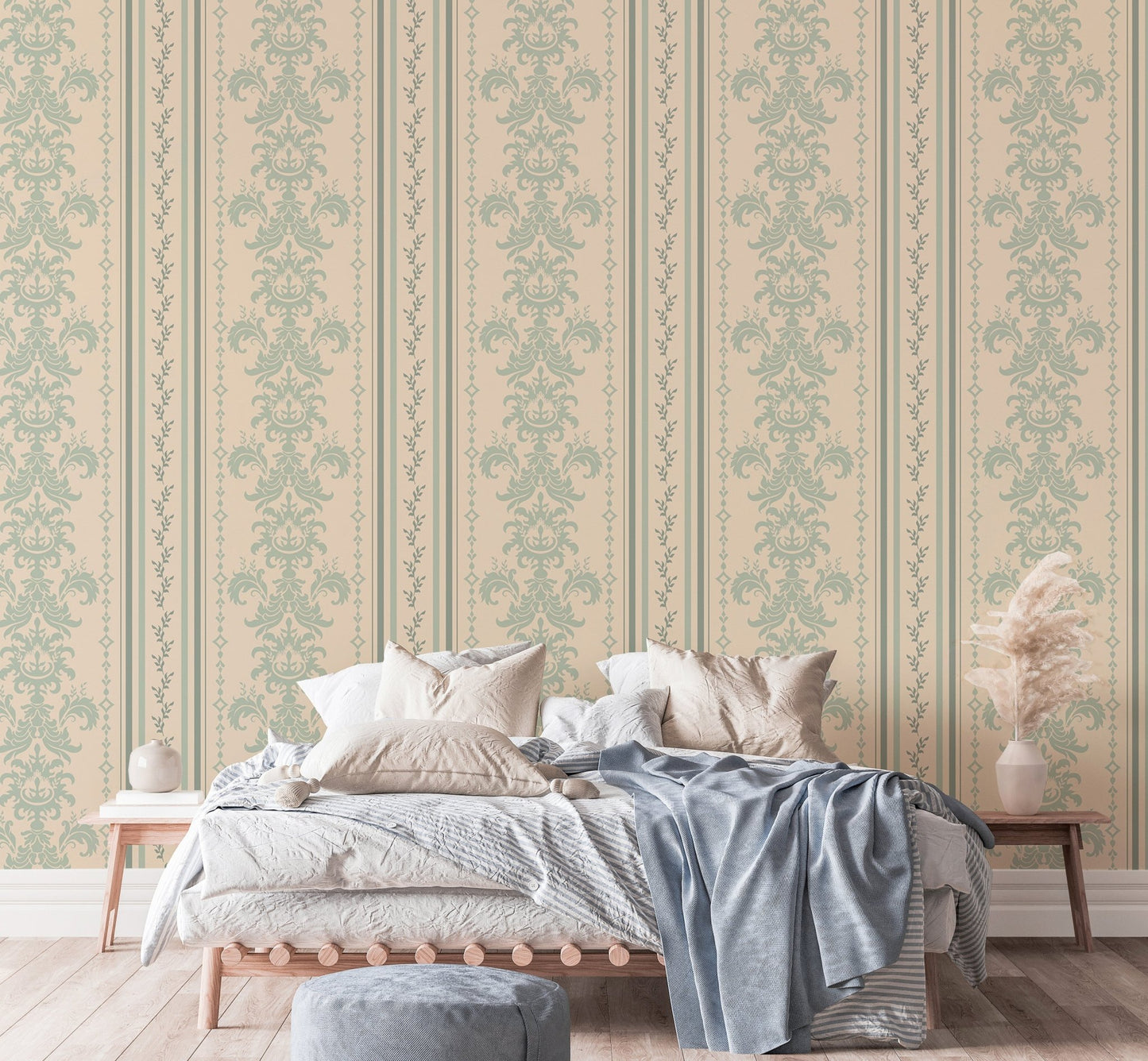 Sage green and beige damask wallpaper in a master bedroom with neutral linens.