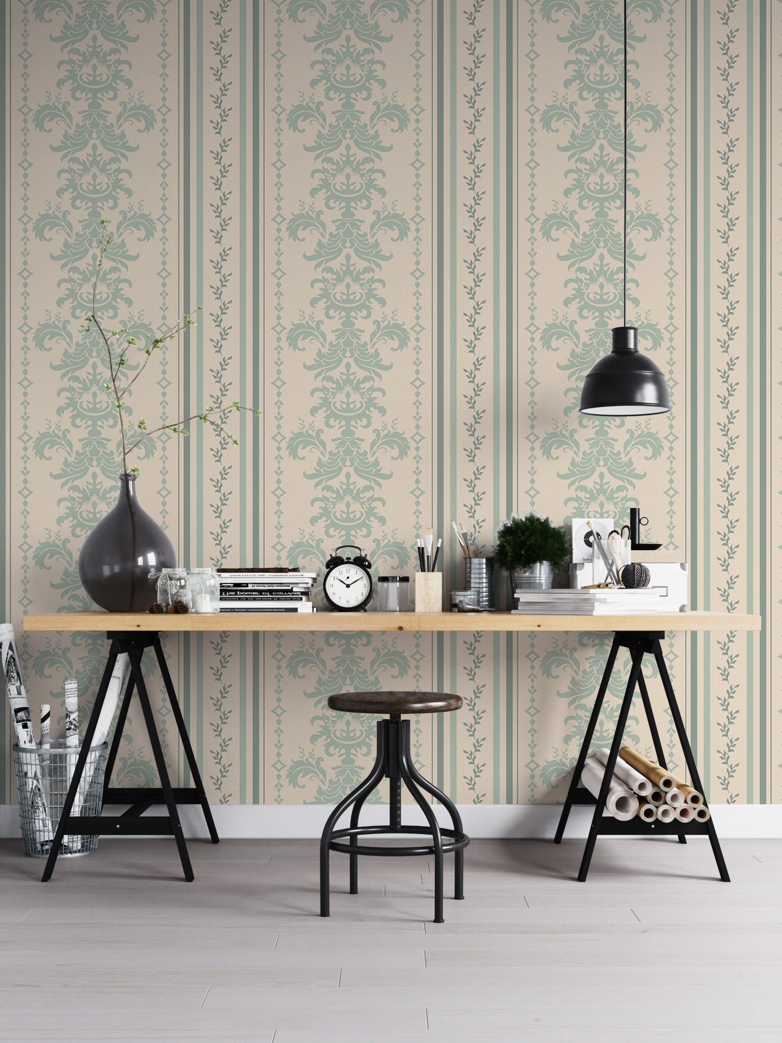 Damask pattern wallpaper in a home office with a black trestle desk and stool.