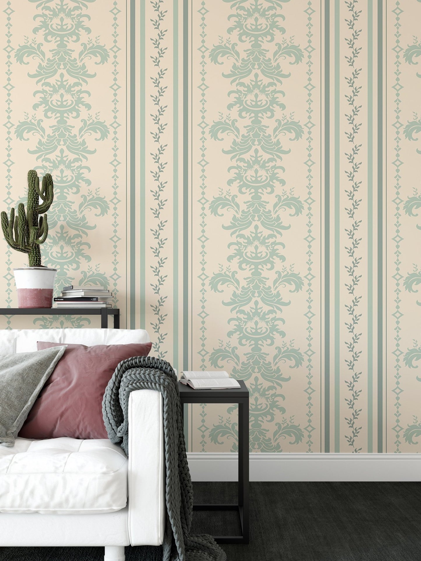 Vintage striped wallpaper next to a black side table and white sofa in living area.
