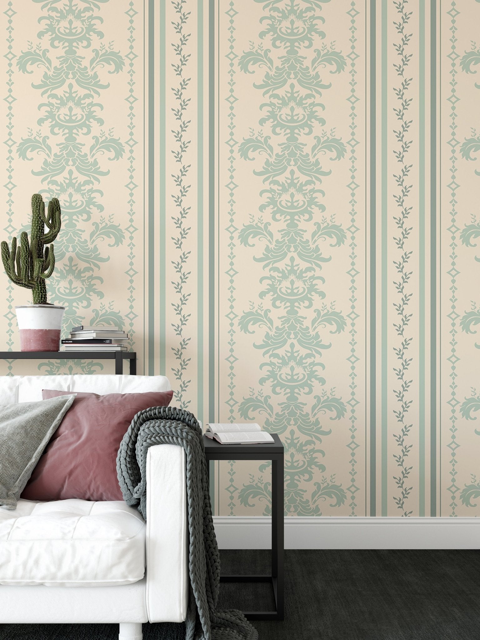 Vintage striped wallpaper next to a black side table and white sofa in living area.