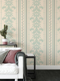 Vintage striped wallpaper next to a black side table and white sofa in living area.