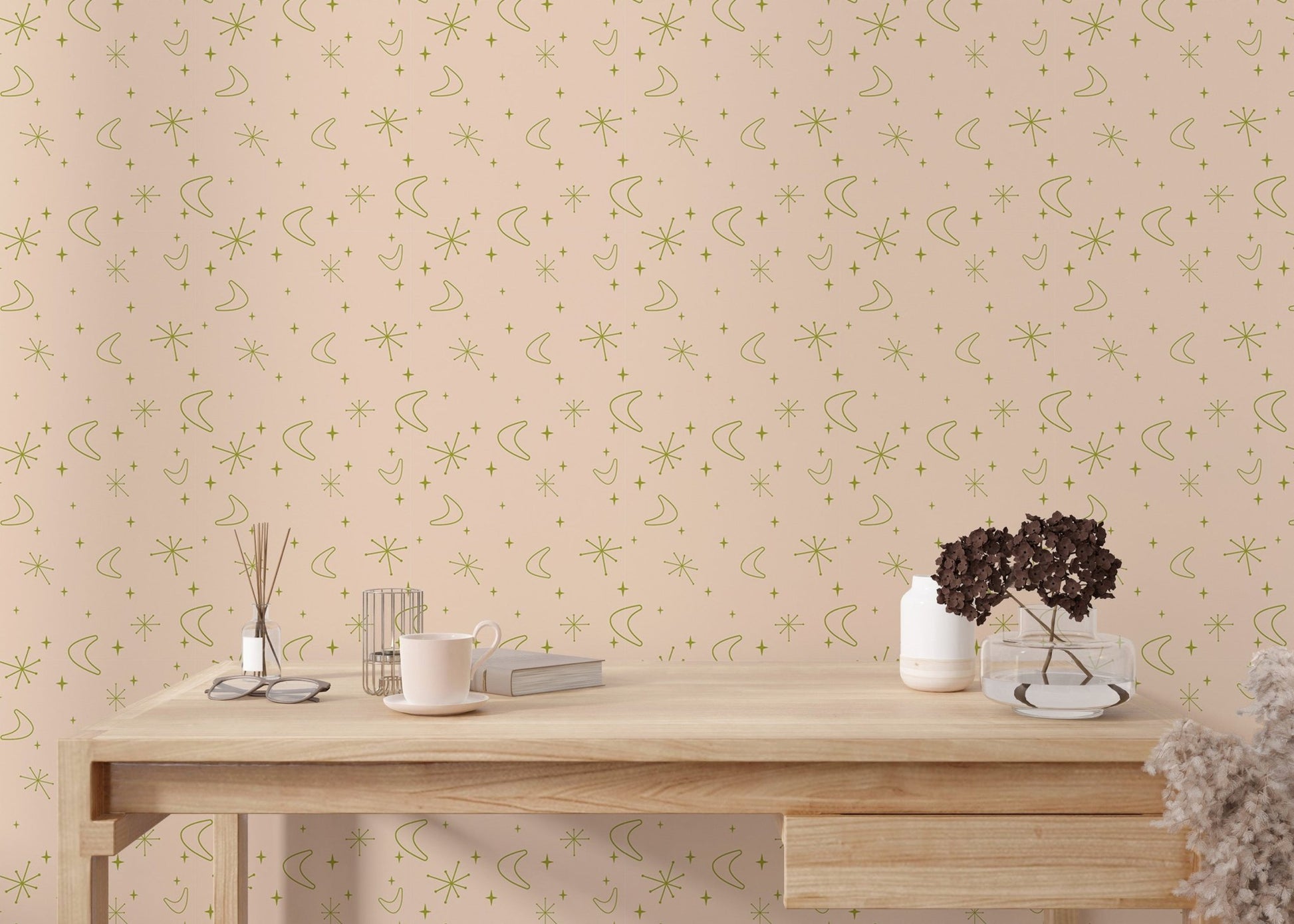 Pastel moon and star wall mural used in a workspace with a wooden desk.
